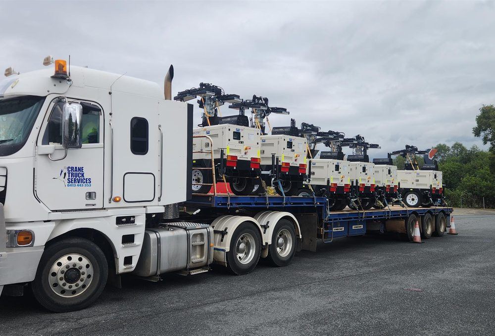 Drop deck trailer loaded with machinery