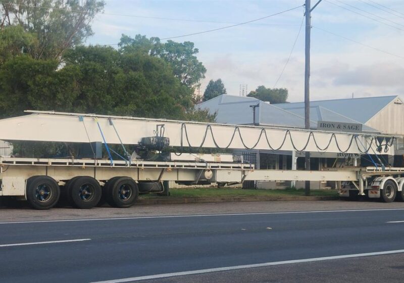 Long load moving through town