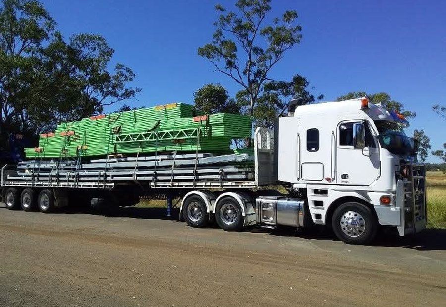Heavy machinery loaded on a Select Haulage drop deck trailer