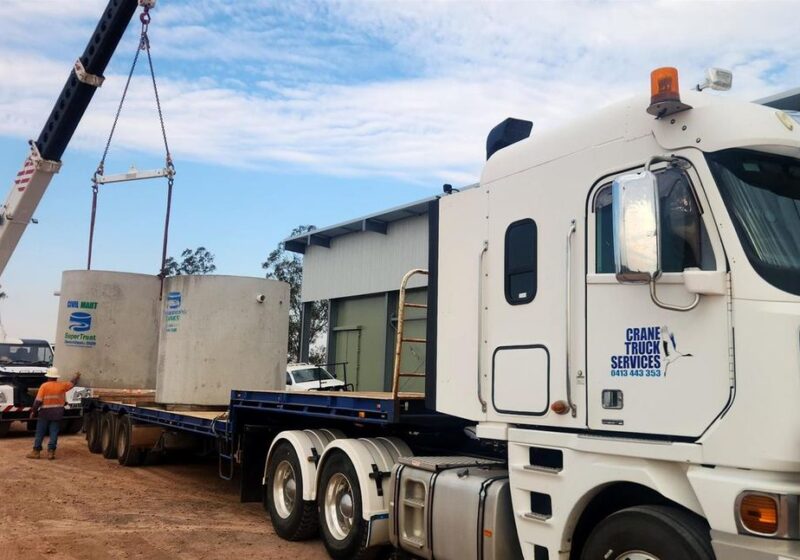 Precast concrete tanks loaded for delivery