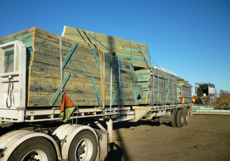 Structural timber loaded and strapped